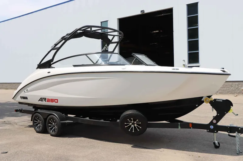 Slide: The Image of 2024 Yamaha Boats AR250 on trailer, sleek design, parked outdoors. - 5