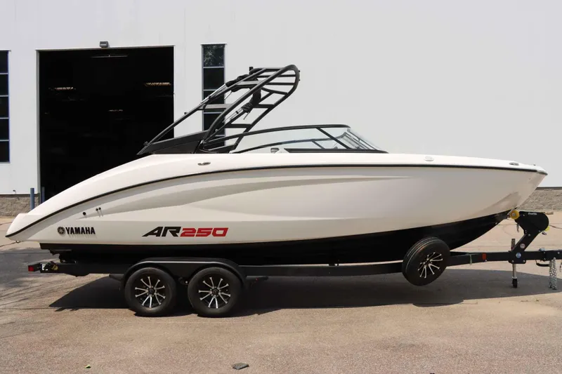 Slide: The Image of 2024 Yamaha AR250 boat on trailer, sleek design, parked outdoors. - 6
