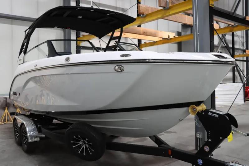 Slide: The Image of 2024 Yamaha Boats 222SD on trailer in warehouse setting. - 1
