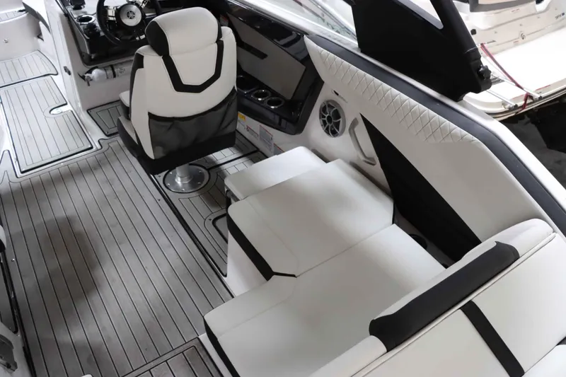 Slide: The Image of 2024 Yamaha Boats 222SD interior with sleek seating and modern dashboard design. - 13
