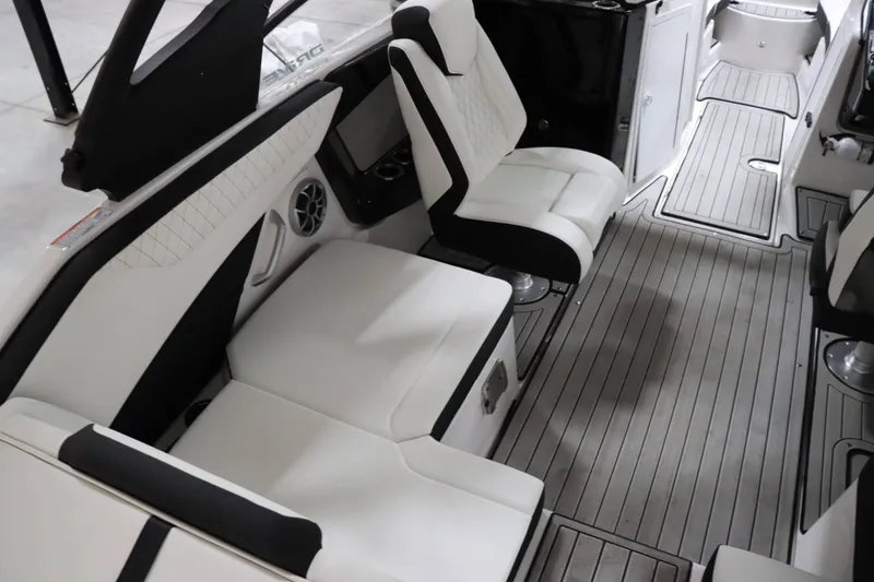 Slide: The Image of 2024 Yamaha Boats 222SD interior with white seating and sleek flooring. - 14