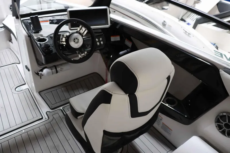 Slide: The Image of 2024 Yamaha Boats 222SD cockpit with modern steering and comfortable seating. - 15