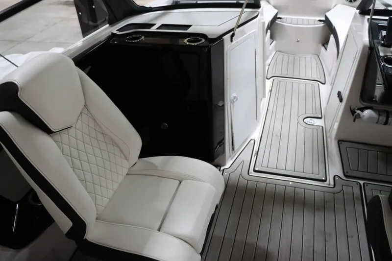 Slide: The Image of 2024 Yamaha Boats 222SD interior with luxurious seating and sleek design. - 16