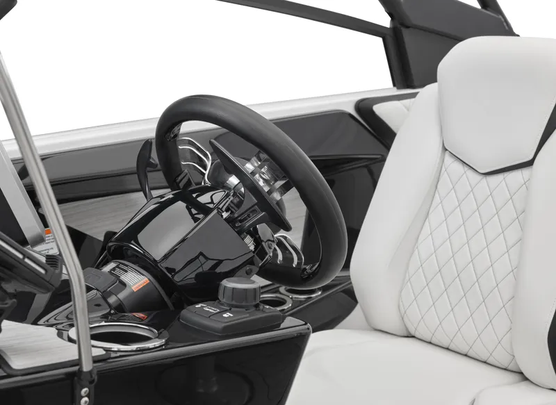 Slide: The Image of 2024 Yamaha Boats 222SD steering wheel and driver's seat close-up. - 28