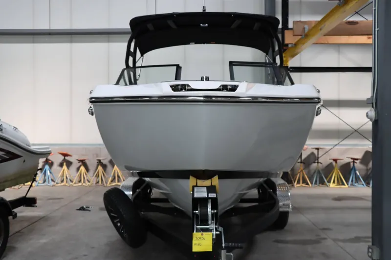 Slide: The Image of 2024 Yamaha Boats 222SD in a showroom, front view. - 4
