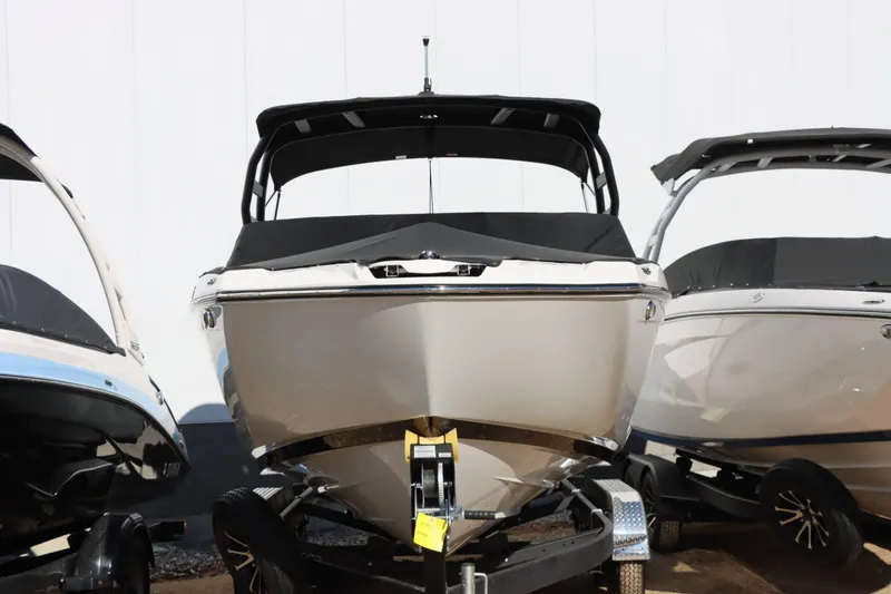 Slide: The Image of 2024 Yamaha Boats 222SD on trailer, front view, with protective cover. - 7
