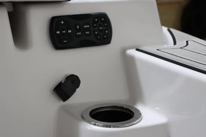 Slide: The Image of 2024 Yamaha Boats 222SD control panel and cup holder detail. - 9