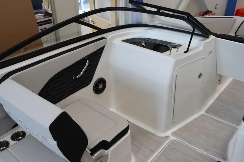 Slide: The Image of Interior of 2024 Sea Ray 210SPX boat, featuring seating and storage compartments. - 10