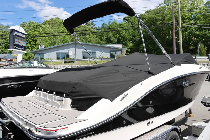 Slide: The Image of 2024 Sea Ray 210SPX boat with black cover at Irwin Marina. - 14