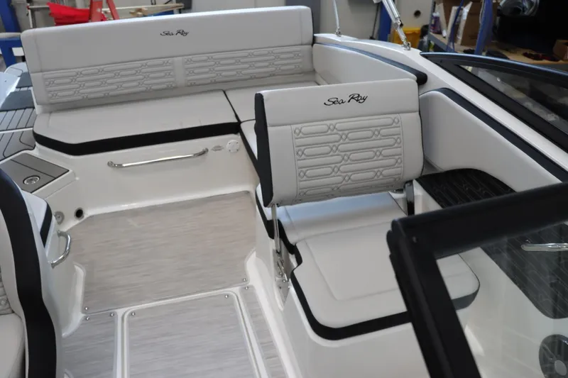 Slide: The Image of 2024 Sea Ray 210SPX boat interior with white and gray seating. - 9