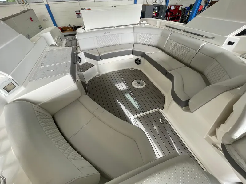 Slide: The Image of 2024 Sea Ray 350 SLX boat interior with luxurious seating and modern design. - 12