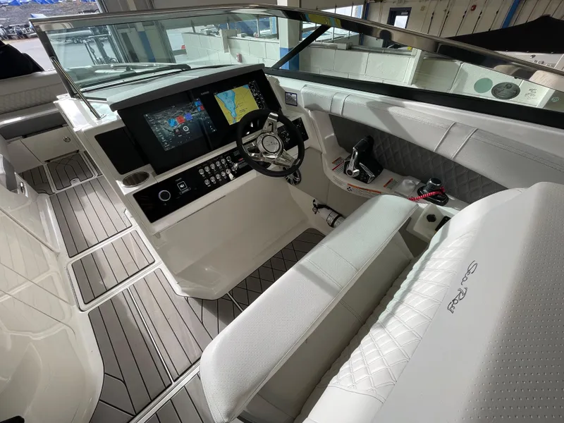 Slide: The Image of 2024 Sea Ray 350 SLX boat cockpit with modern controls and navigation system. - 9