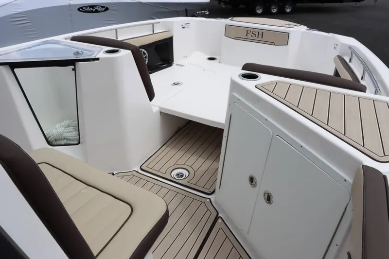 Slide: The Image of 2023 Yamaha Boats 255FSH SPORT E interior with seating and storage compartments. - 12