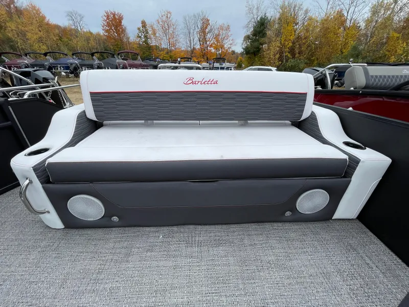 Slide: The Image of 2024 Barletta Corsa 23UC boat seating with cup holders and speakers. - 12