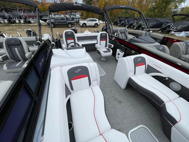 Slide: The Image of 2024 Barletta Corsa 23UC pontoon boat with luxurious seating and modern design. - 13