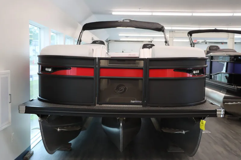 Slide: The Image of 2024 Barletta Corsa 23UC pontoon boat in showroom, front view. - 2