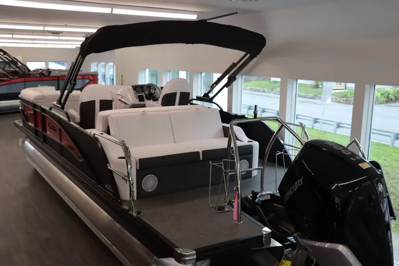 Slide: The Image of 2024 Barletta Corsa 23UC pontoon boat with Mercury engine in showroom. - 4