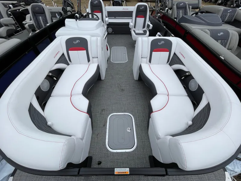 Slide: The Image of 2024 Barletta Corsa 23UC pontoon boat interior with white and gray seating. - 9