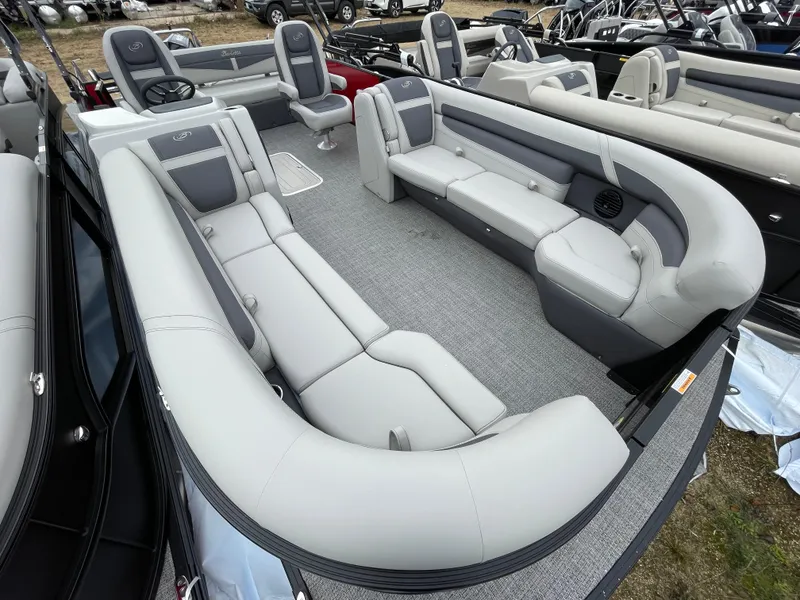 Slide: The Image of 2024 Barletta Cabrio 24UC pontoon boat with spacious seating and modern design. - 11