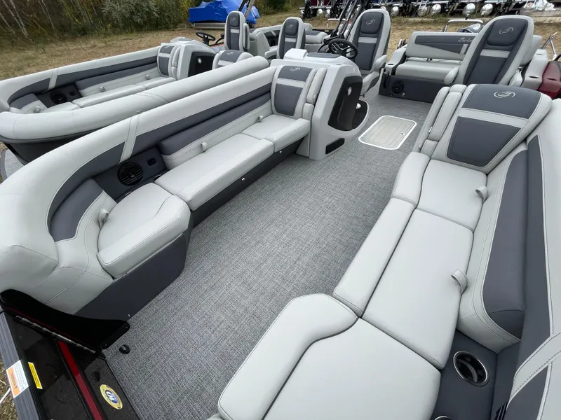 Slide: The Image of 2024 Barletta Cabrio 24UC pontoon boat interior with luxurious seating and modern design. - 12