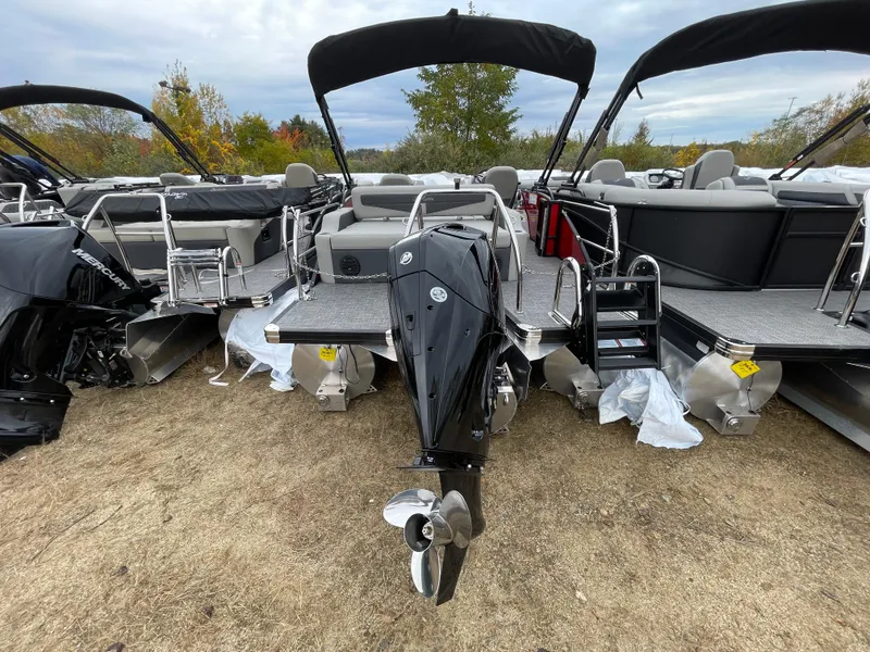 Slide: The Image of 2024 Barletta Cabrio 24UC pontoon boat with Mercury outboard motor, rear view. - 13
