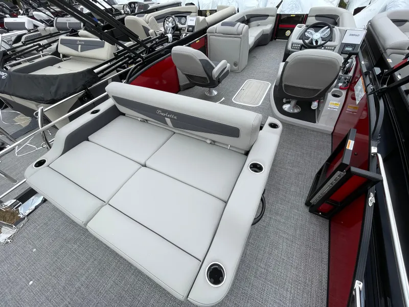 Slide: The Image of 2024 Barletta Cabrio 24UC pontoon boat interior with plush seating and modern dashboard. - 15