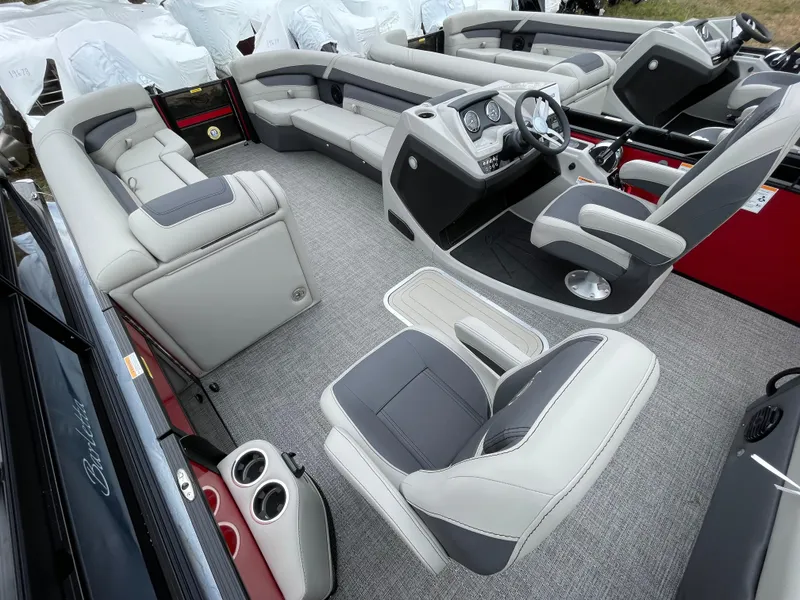 Slide: The Image of Interior of 2024 Barletta Cabrio 24UC pontoon boat with luxurious seating and modern dashboard. - 17