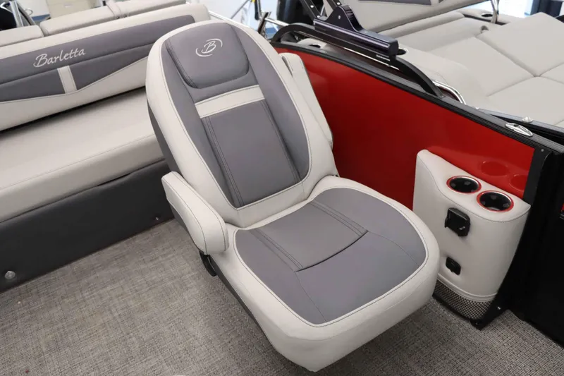 Slide: The Image of 2024 Barletta Cabrio 24UC boat interior with gray seat and cup holders. - 18