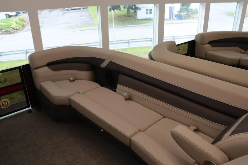Slide: The Image of 2024 Barletta Cabrio 24UC boat interior with luxurious beige seating. - 22