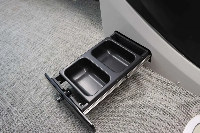 Slide: The Image of 2024 Barletta Cabrio 24UC boat with dual-compartment storage drawer. - 23