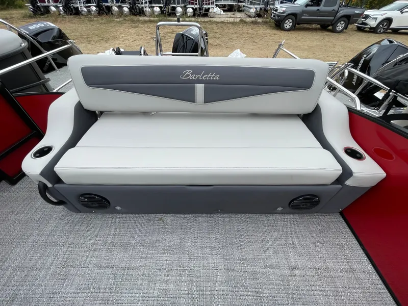 Slide: The Image of 2024 Barletta Cabrio 24UC boat with gray and white cushioned seating. - 3