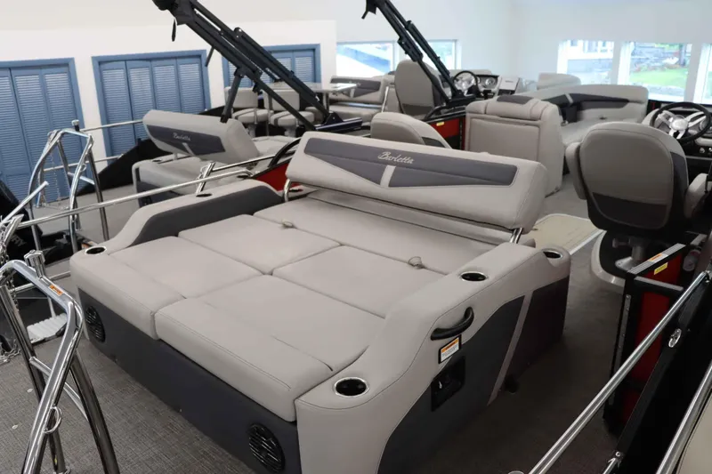 Slide: The Image of 2024 Barletta Cabrio 24UC pontoon boat interior with plush seating and modern design. - 5