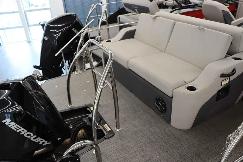 Slide: The Image of 2024 Barletta Cabrio 24UC boat interior with seating and Mercury engine. - 6