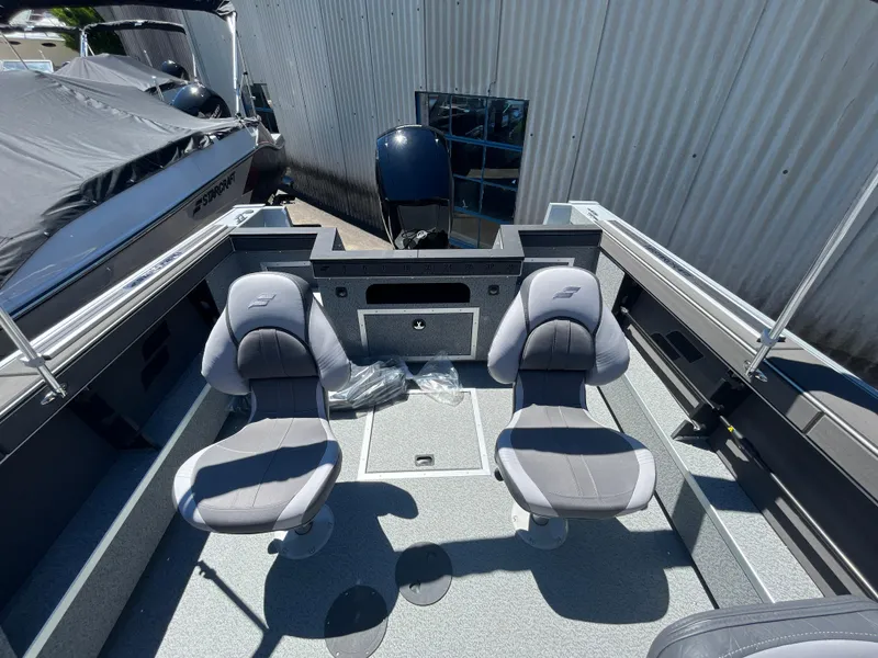 Slide: The Image of 2024 Starcraft Fishmaster 196 DC boat interior with two grey seats. - 12