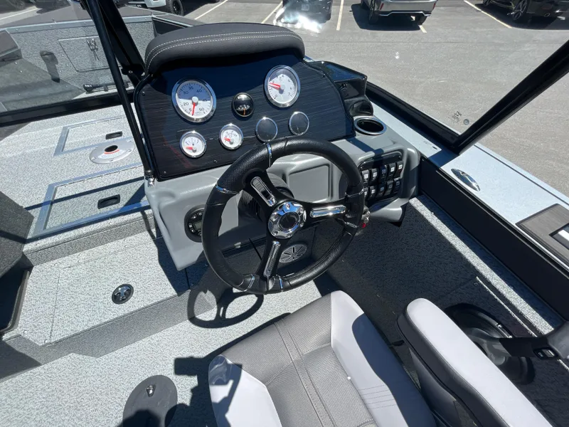 Slide: The Image of 2024 Starcraft Fishmaster 196 DC boat dashboard and steering wheel. - 9