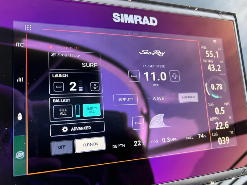 Slide: The Image of Simrad display on 2023 Sea Ray 260SXS showing SmartTow surf settings and fuel data. - 10