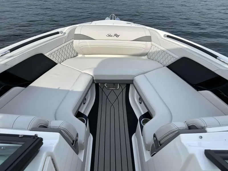 Slide: The Image of 2023 Sea Ray 260SXS boat interior with luxurious white seating and elegant design. - 5