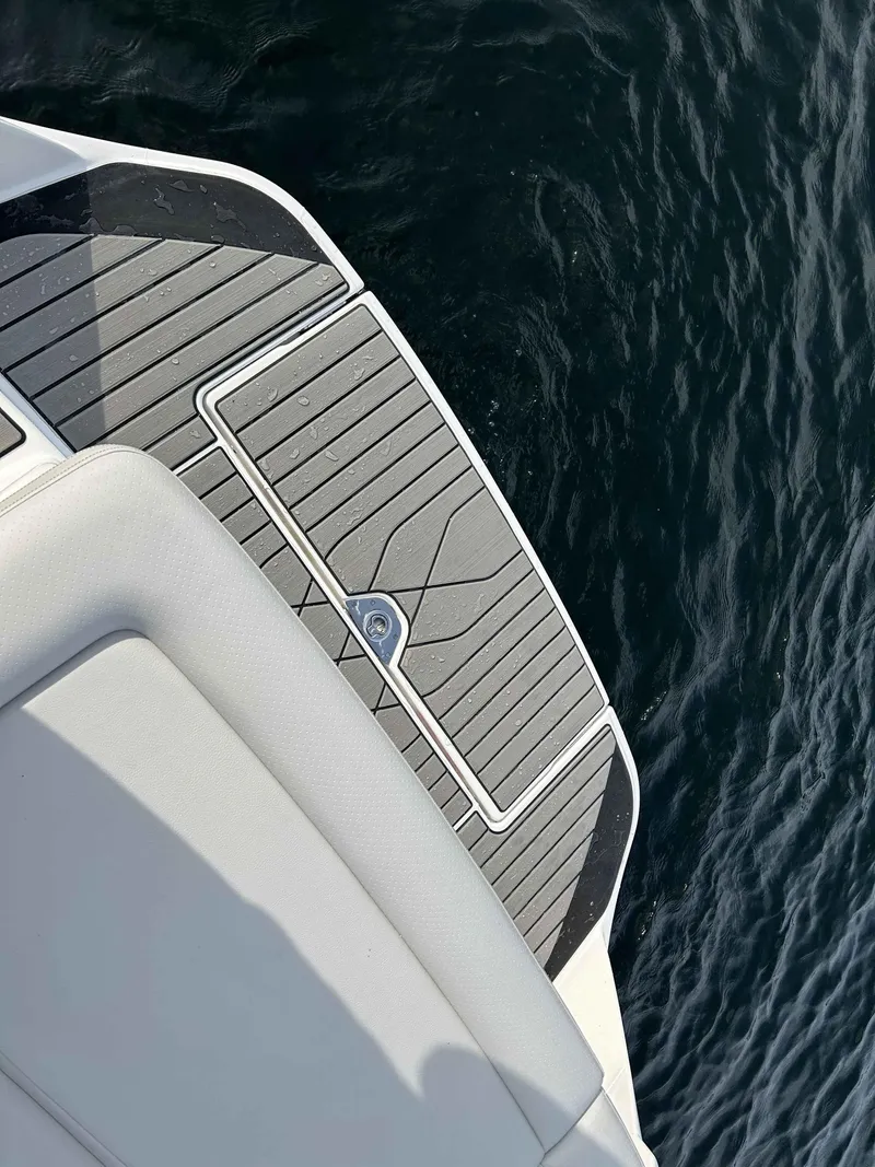 Slide: The Image of 2023 Sea Ray 260SXS boat deck with water backdrop. - 7