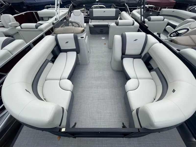 Slide: The Image of 2024 Starcraft EXS 3Q pontoon boat interior with plush seating. - 7