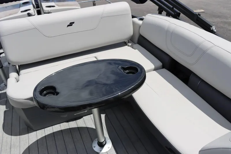 Slide: The Image of 2023 Starcraft CX 23DL Bar boat interior with seating and table. - 11
