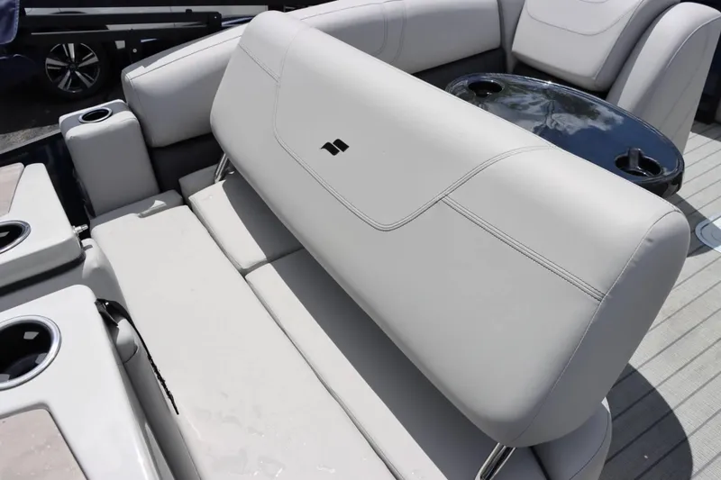 Slide: The Image of 2023 Starcraft CX 23DL Bar boat interior with plush seating and cup holders. - 12