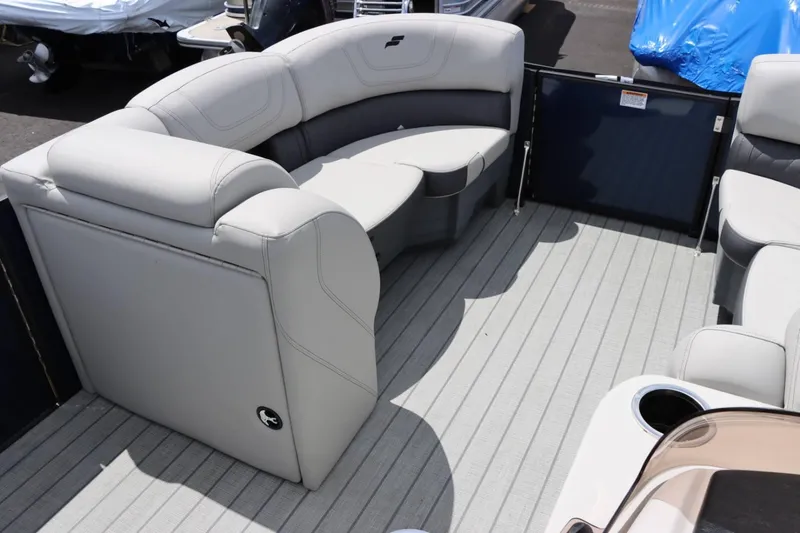 Slide: The Image of 2023 Starcraft CX 23DL Bar pontoon boat interior with plush seating and modern design. - 16