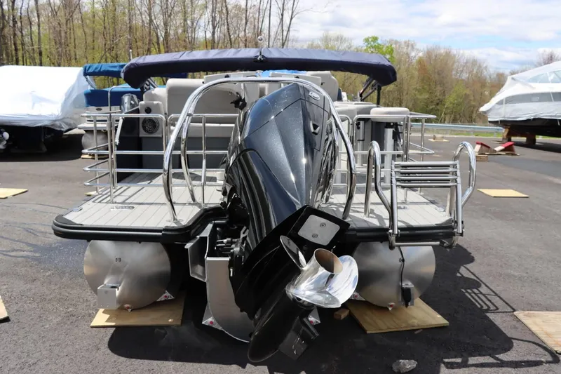 Slide: The Image of 2023 Starcraft CX 23DL Bar pontoon boat with outboard motor, rear view. - 6