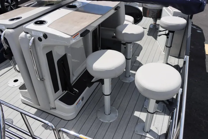 Slide: The Image of 2023 Starcraft CX 23DL Bar interior with bar stools and table. - 7
