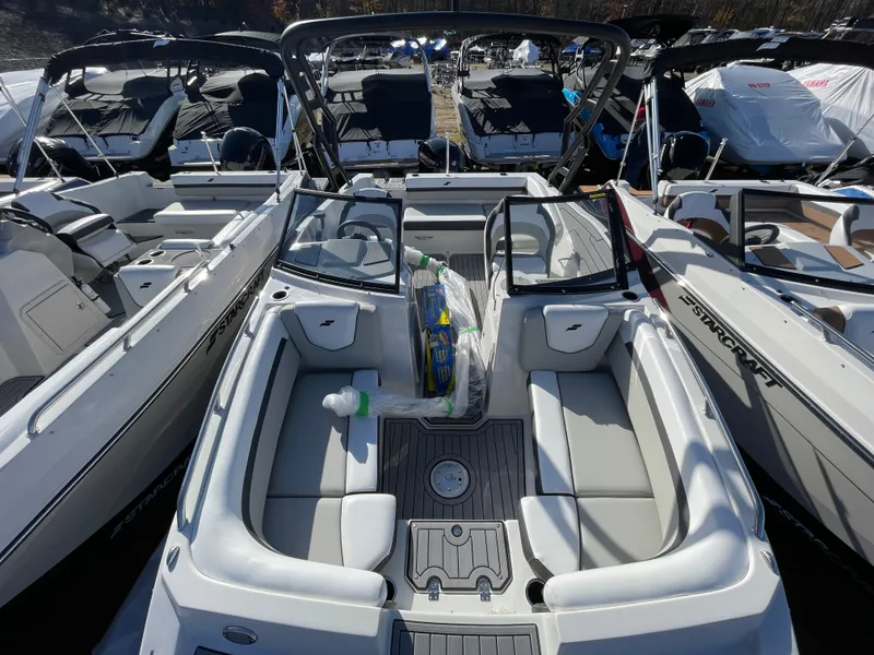 Slide: The Image of 2024 Starcraft SVX 190 OB boat interior with seating and dashboard. - 15