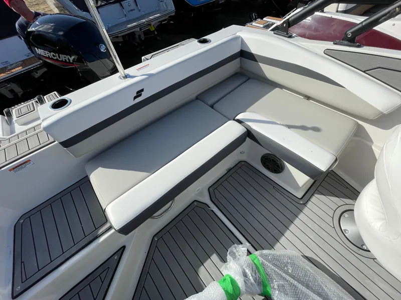 Slide: The Image of 2024 Starcraft SVX 190 OB boat interior with seating and Mercury outboard motor. - 18
