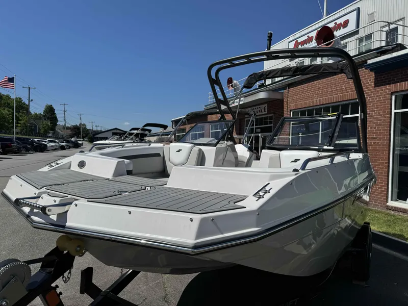 Slide: The Image of 2024 Starcraft SVX 190 OB boat displayed outside a dealership. - 3