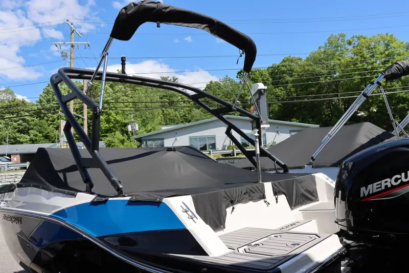 Slide: The Image of 2024 Starcraft SVX 190 OB boat with black cover and Mercury outboard motor. - 7