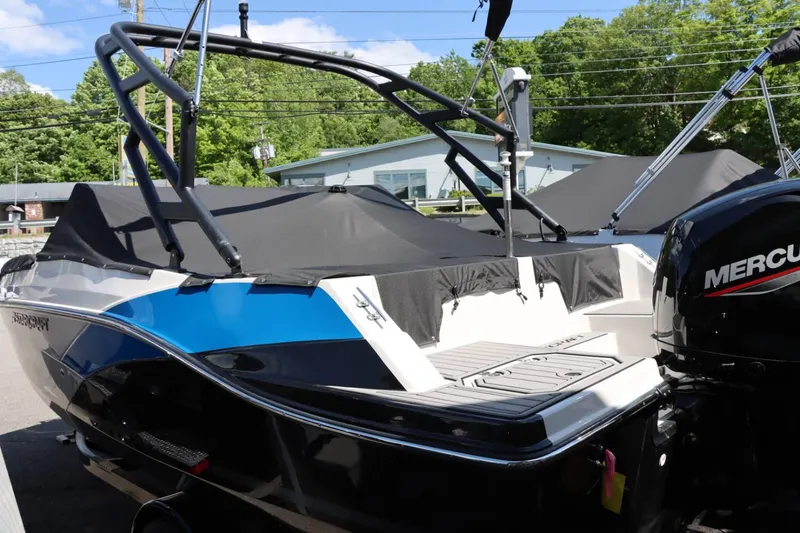 Slide: The Image of 2024 Starcraft SVX 190 OB boat with Mercury outboard motor, covered and docked. - 9
