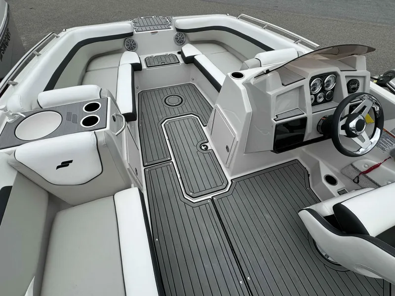 Slide: The Image of 2024 Starcraft SVX 191 OB boat interior with modern dashboard and seating. - 19